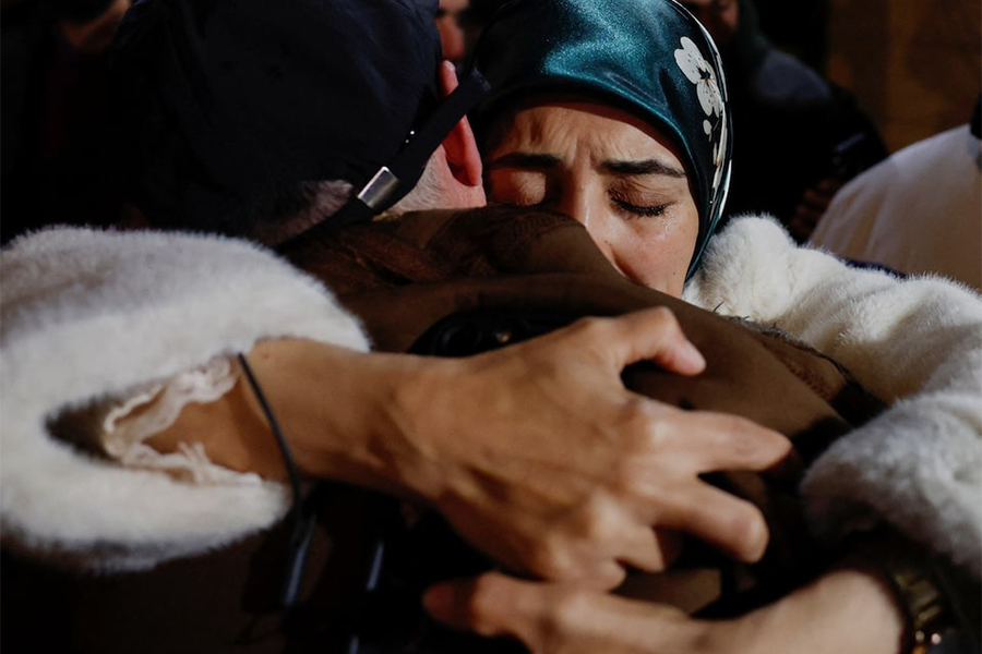 People embrace and react as Palestinian prisoners arrive on a bus after they were released from an Israeli jail as part of a hostages-prisoners swap and a ceasefire deal in Gaza between Hamas and Israel, in Ramallah, in the Israeli-occupied West Bank on February 27, 2025 — Reuters photo