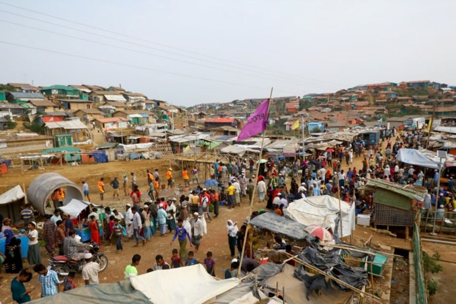 Rohingya refugees gather at a market inside a refugee camp in Cox's Bazar, Bangladesh, March 7, 2019.