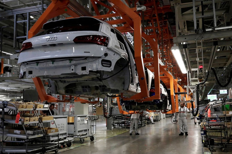 Employees work at an Audi Q5 2.0 production line of the German car manufacturer's plant during a media tour in San Jose Chiapa, Mexico April 19, 2018.