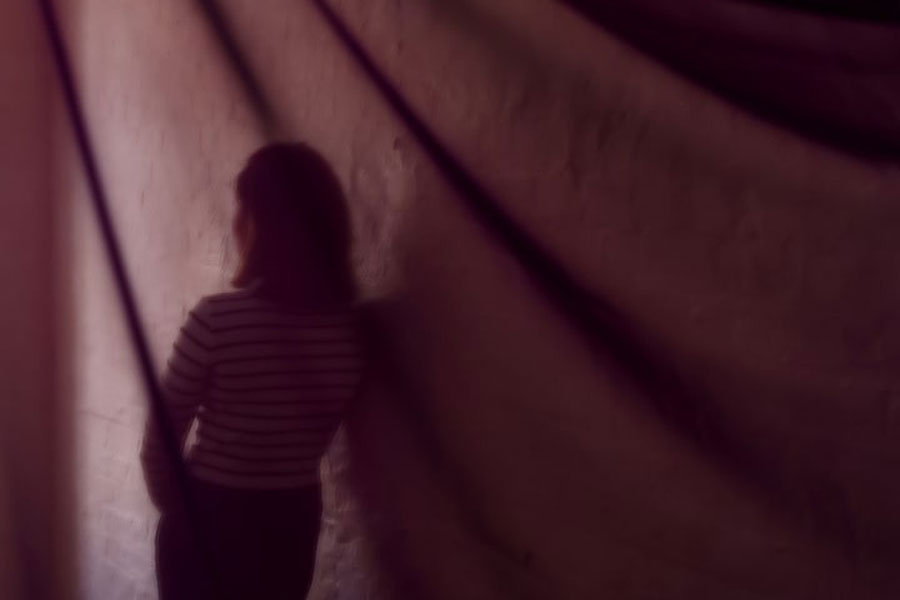 A suspected victim of modern slavery, who was initially denied state support after Britain introduced a tougher immigration policy, poses for a portrait following an interview with Reuters in London, Britain, September 19, 2024.