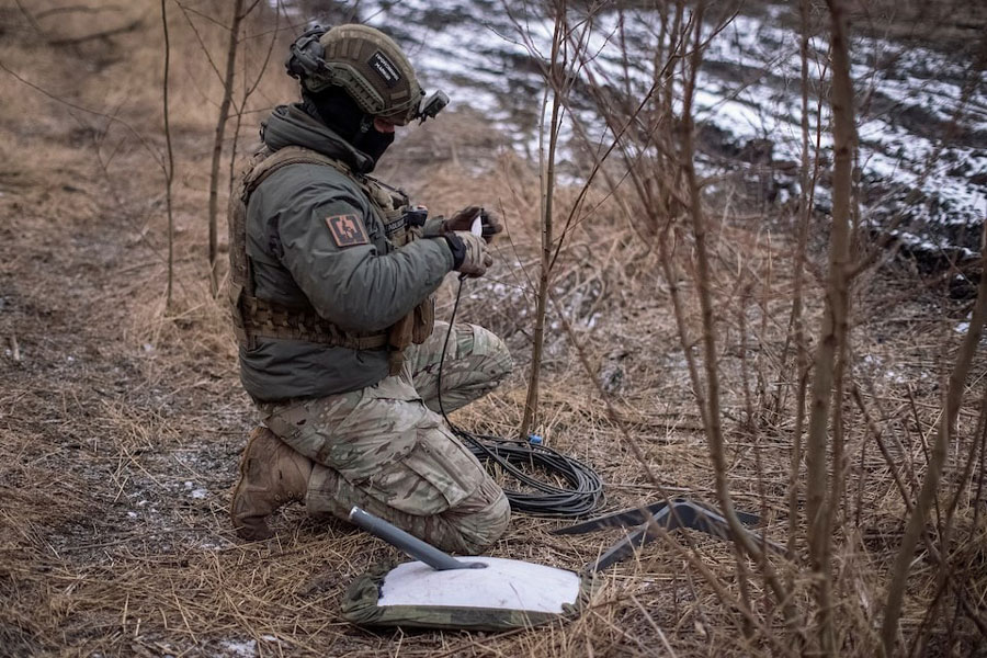 A Ukrainian serviceman of 47th brigade prepares a Starlink satellite internet systems at his positions at a front line, amid Russia's attack on Ukraine, near the town of Avdiivka, recently captured by Russian troops in Donetsk region, Ukraine February 20, 2024.