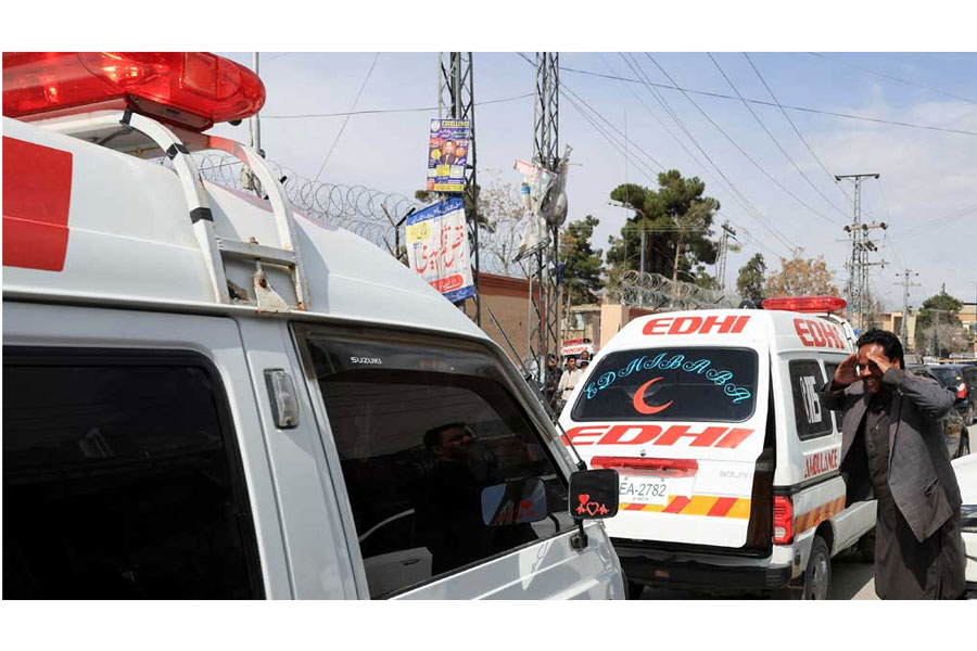 A man reacts next to ambulances carrying the bodies of victims, who were killed after a train was attacked by separatist militants in Bolan, in Quetta, Pakistan, Mar 13, 2025.