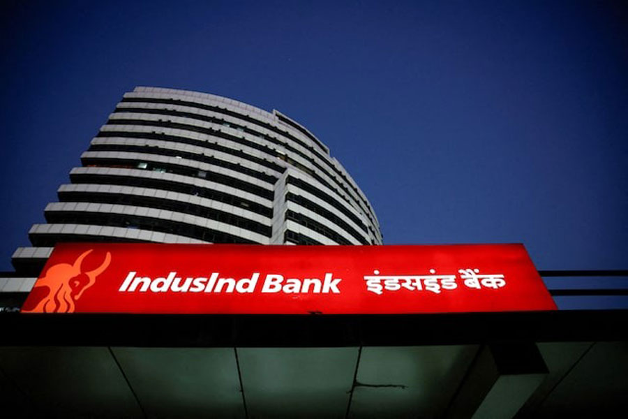 An illuminated signboard of IndusInd Bank is seen outside one of its branches, in New Delhi, India, September 20, 2024.