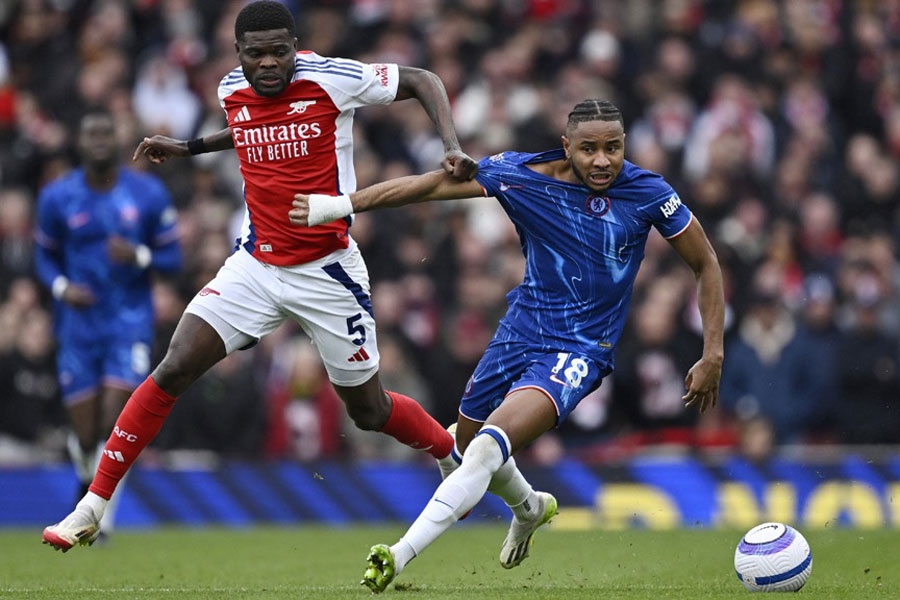 Premier League - Arsenal v Chelsea - Emirates Stadium, London, Britain - Mar 16, 2025 Chelsea's Christopher Nkunku in action with Arsenal's Thomas Partey REUTERS/Tony O Brien