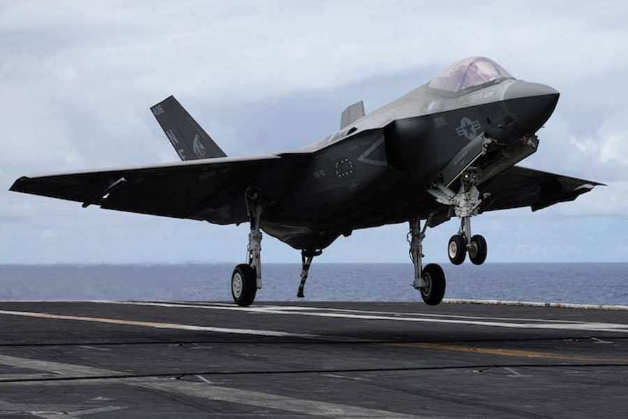 A F-35 jet lands on the USS Carl Vinson aircraft carrier during the Rim of the Pacific (RIMPAC) military exercises about 100 miles south of Oahu, Hawaii, US, July 19, 2024.