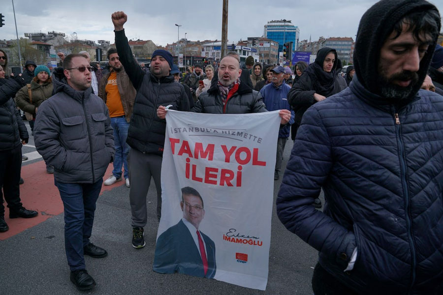 Supporters of Istanbul Mayor Ekrem Imamoglu gather near the city's police headquarters in Istanbul, Turkey, March 19, 2025.