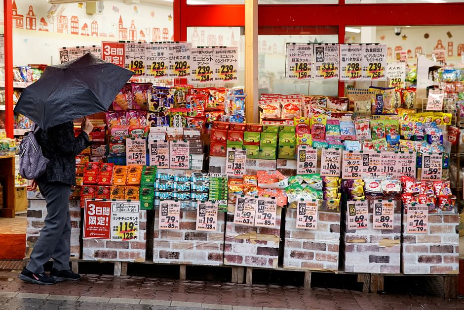 A woman looks at items at a shop in Tokyo, Japan, March 24, 2023. REUTERS