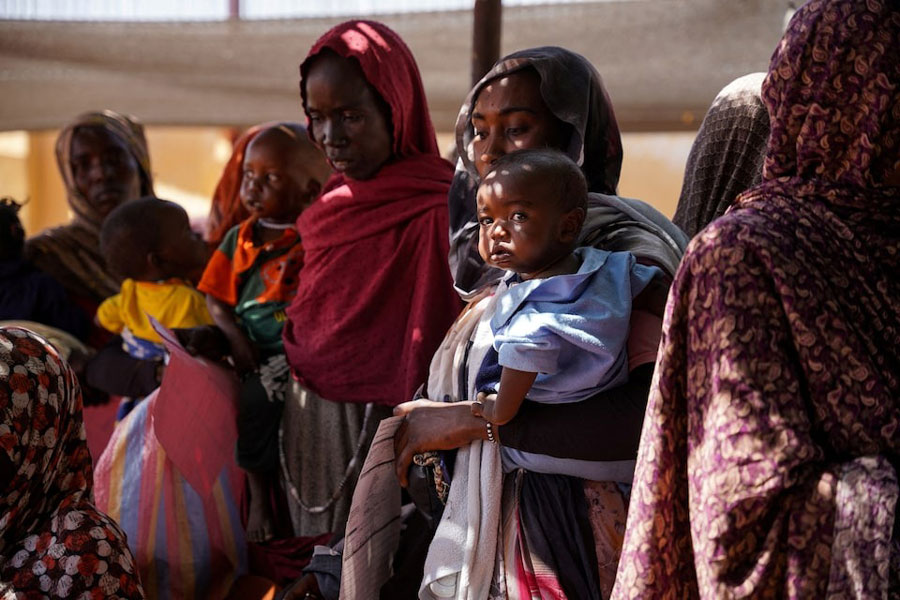 A handout photograph, shot in January 2024, shows women and babies at the Zamzam displacement camp, close to al-Fashir in North Darfur, Sudan.