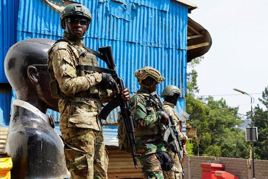 Members of the M23 rebel group stand guard as people attend a rally addressed by Corneille Nangaa, Congolese rebel leader and coordinator of the AFC-M23 movement, in Bukavu, eastern Democratic Republic of Congo February 27, 2025.