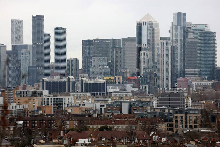 A view of the Canary Wharf financial district and residential houses in London, Britain, January 23, 2025.