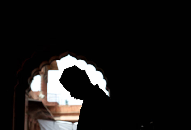 A Muslim man offers prayers during Jumat-ul-Vida, or the last Friday of the holy fasting month of Ramadan, inside Jama Masjid (Grand Mosque) in the old quarters of Delhi, India, April 5, 2024. REUTERS/Priyanshu Singh/File photo