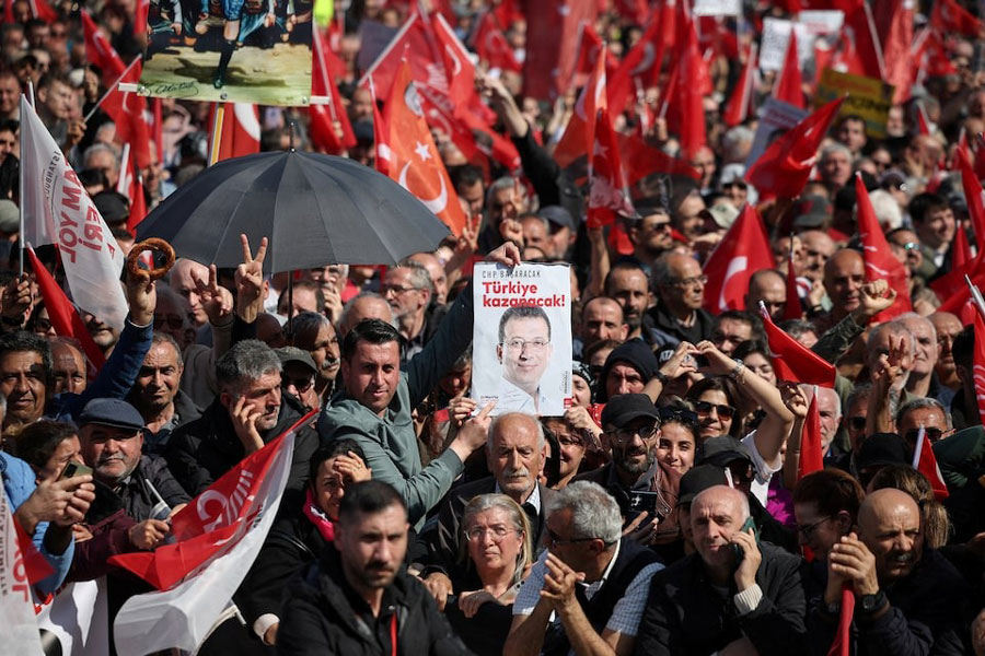 People hold up a poster reading, "Turkey will win", at a rally, to protest against the arrest of Istanbul Mayor Ekrem Imamoglu as part of a corruption investigation, in Istanbul, Turkey, March 29, 2025.