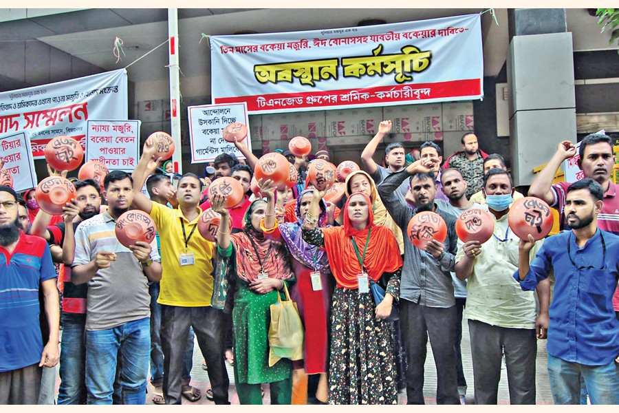 Workers of TNZ Group demonstrate in front of the Shrama Bhaban in the city on Saturday demanding payment of three months' pay arrears and Eid allowance. — Focus Bangla