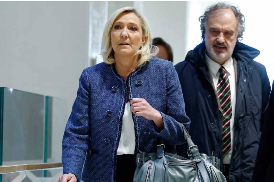 French far-right leader Marine Le Pen, member of parliament of the Rassemblement National (National Rally - RN) party, walks on the day of the verdict of her trial alongside 24 other defendants (party officials and employees, former lawmakers and parliamentary assistants) and the RN party itself, over accusations of misappropriation of European Union funds, at the courthouse in Paris, France, Mar 31, 2025.