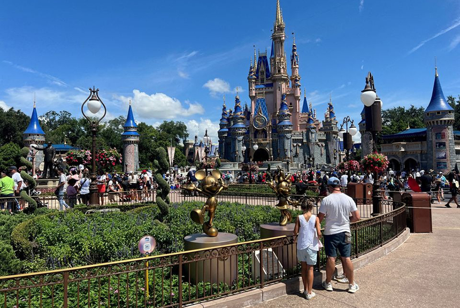 People gather ahead of the "Festival of Fantasy" parade at the Walt Disney World Magic Kingdom theme park in Orlando, Florida, US on July 30, 2022 — Reuters/Files