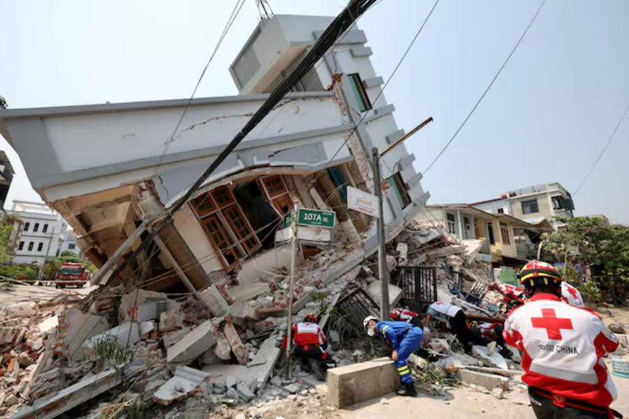Members of the Chinese Red Cross International Emergency Response Team work at a collapsed residential building following the earthquake, in Mandalay, Myanmar March 31, 2025.