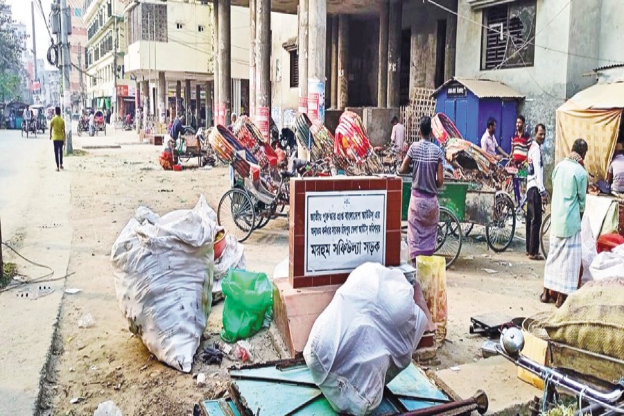 A partial view of under-construction Chandpur Paura Auditorium in Chandpur town, occupied by rickshaws pullers — FE Photo