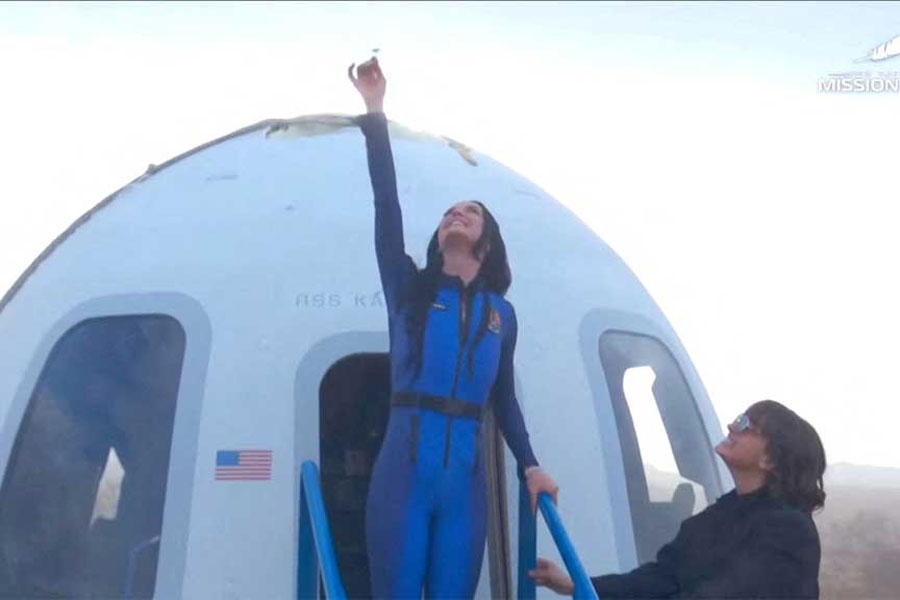 Pop star Katy Perry comes out of the capsule in which she, journalists Gayle King, Lauren Sanchez, who is also billionaire Jeff Bezos' fiance and other participants, landed back on earth after blasting off into space on a Blue Origin rocket, as part of the New Shepard Mission NS-31, marking the first all-female flight crew in more than six decades, in West Texas, Texas, US, Apr 14, 2025, in this screen grab taken from a video.