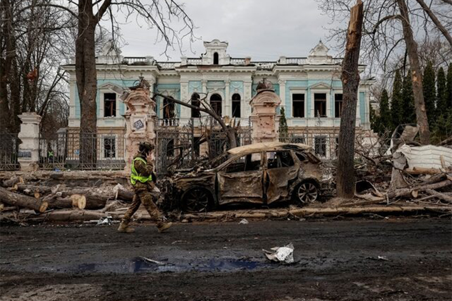 A Ukrainian serviceman walks at the site of a Russian missile strike, amid Russia's attack on Ukraine, in Sumy, Ukraine on April 13, 2025 — Reuters photo
