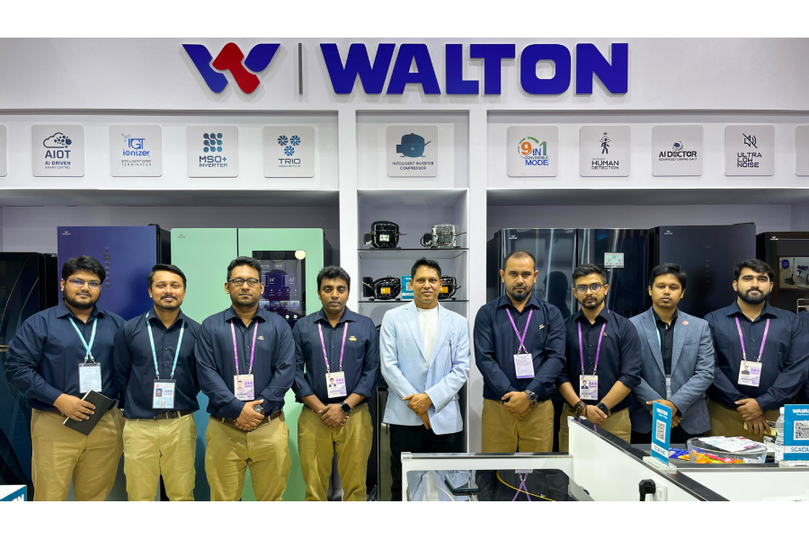 Walton Hi-Tech Industries PLC's Managing Director S M Mahbubul Alam pose for a photograph with the executives of Walton Pavilion at Canton Fair.