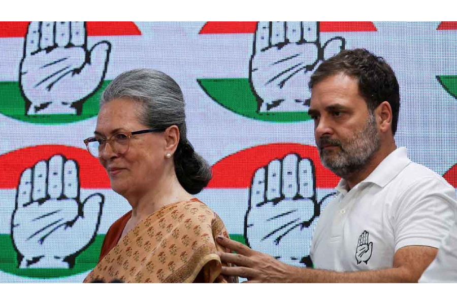 Rahul Gandhi, a senior leader of India's main opposition Congress party, escorts Sonia Gandhi as they attend a press conference at the party's headquarter in New Delhi, India, Jun 4, 2024.