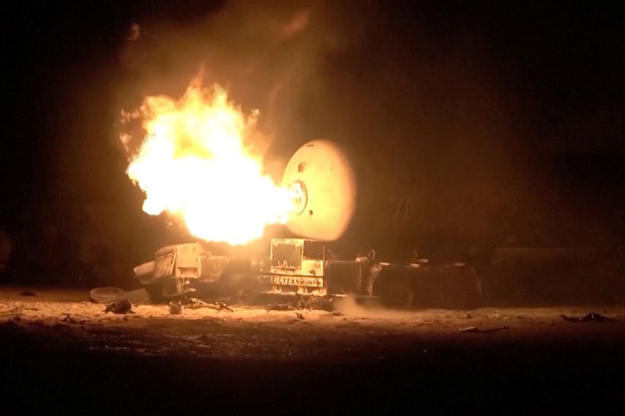 A fuel tank burns following, what Al Masirah TV said, was a US strike on the Ras Isa fuel port, Yemen, in this screengrab from a handout video released on April 18, 2025.