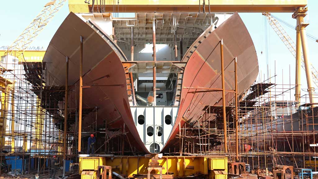 Workers are seen near a vessel under construction at a shipyard of Huanghai Shipbuilding Co in Weihai, Shandong province, China November 6, 2018. REUTERS