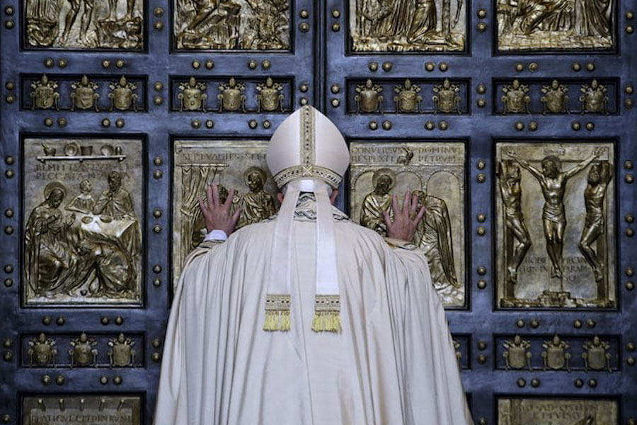 Pope Francis opens the Holy Door to mark the opening of the Catholic Holy Year, or Jubilee, in St. Peter’s Basilica, at the Vatican, December 8, 2015.
