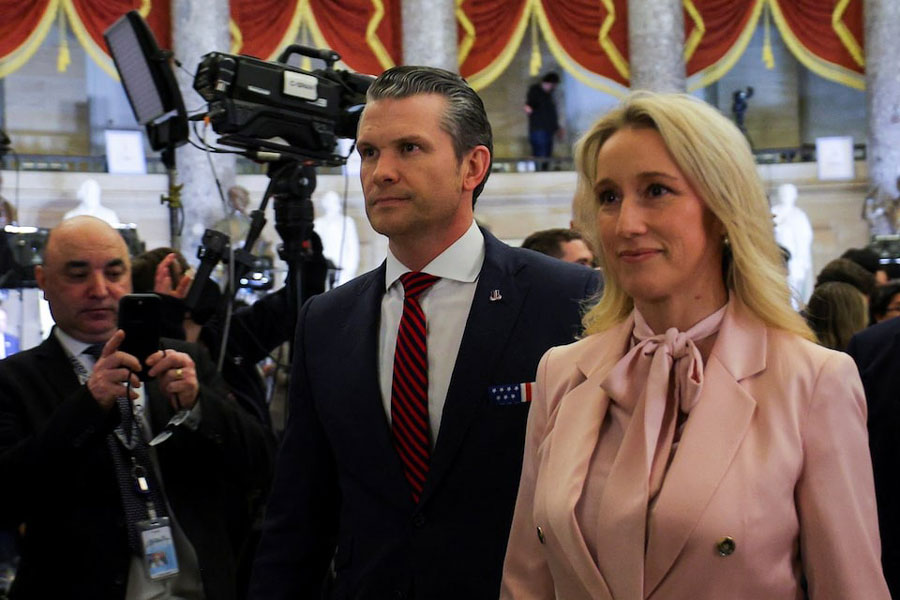 US Secretary of Defense Pete Hegseth and his wife Jennifer Rauchet walk through Statuary Hall prior to US President Donald Trump's speech to a joint session of Congress at the US Capitol in Washington, DC, US, March 4, 2025.