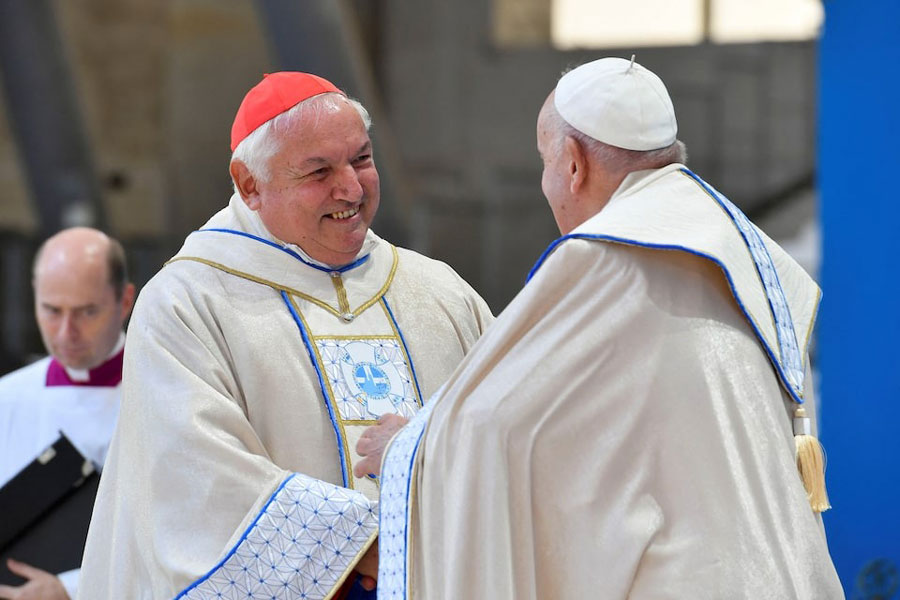 Pope Francis speaks to Marseille's archbishop Cardinal Jean-Marc Aveline, at a mass at the Velodrome Stadium, as a part of his journey on the occasion of the Mediterranean Meetings (MED 2023) in Marseille, France, September 23, 2023.