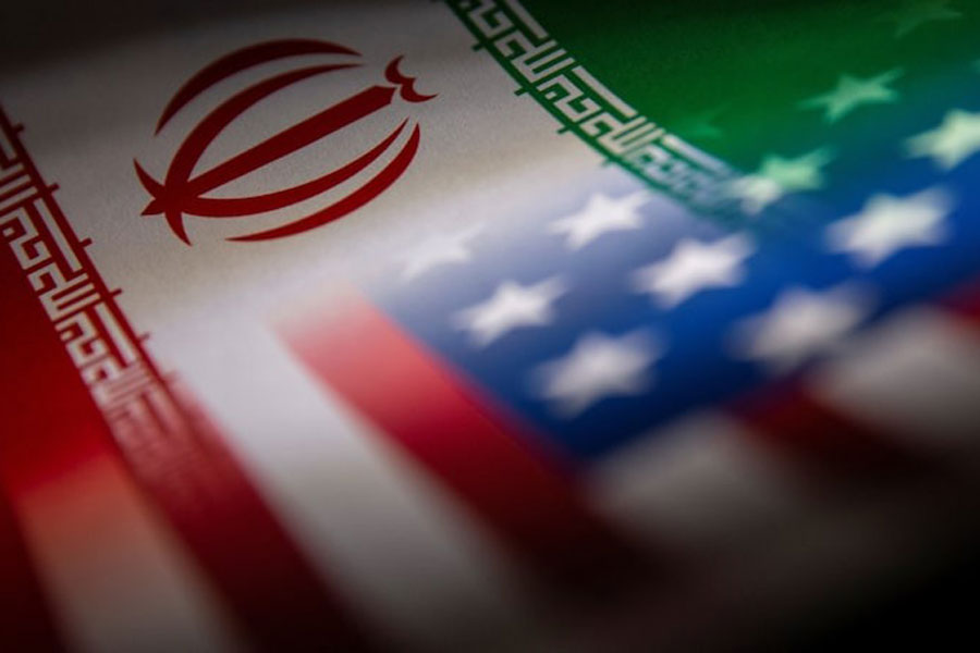 Iran's and US' flags are seen printed on paper in this illustration taken January 27, 2022.