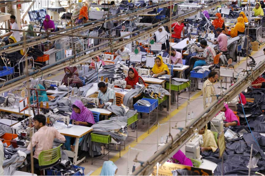 Bangladeshi garment workers make clothing in the sewing section of a factory in Gazipur, Bangladesh, Apr 9, 2025.