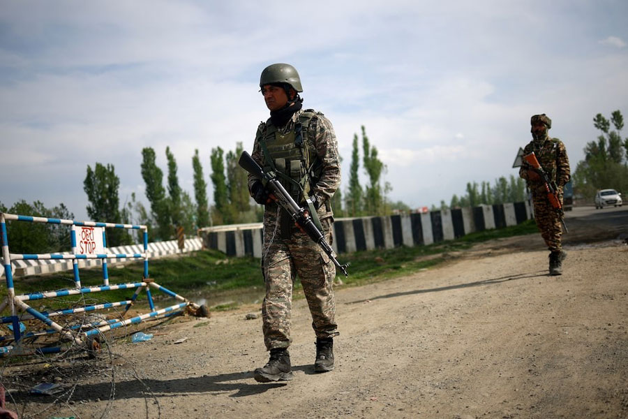 Members of Indian security personnel patrol on a highway leading to South Kashmir's Pahalgam, following a suspected militant attack, in Marhama village, in Kashmir, April 23, 2025.