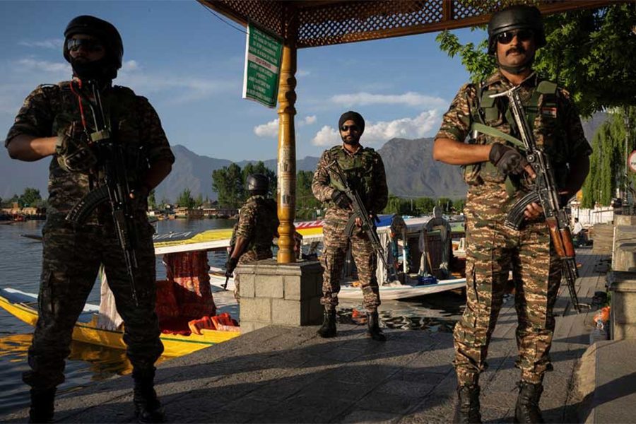 Indian security force personnel stand guard on the banks of Dal Lake, following a suspected militant attack near south Kashmir's Pahalgam, in Srinagar on April 25, 2025 — Reuters photo