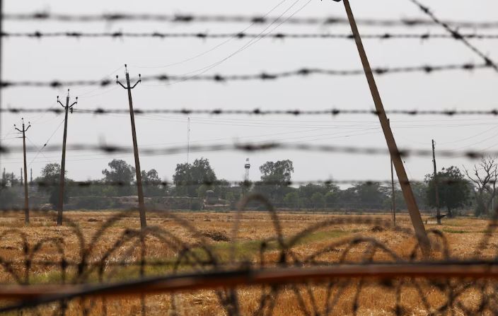 A Pakistan flag is seen on Pakistan Rangers' Post near the Attari-Wagah border crossing near Amritsar, India, April 26, 2025. India has suspended visa services to Pakistani nationals "with immediate effect" following an attack on tourists near Pahalgam in south Kashmir. REUTERS/Anushree Fadnavis