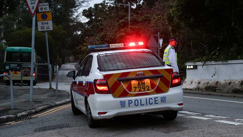 A police officer stands guard outside Stanley Prison during the release of former lawmakers Kwok Ka-ki and Jeremy Tam, convicted in a landmark national security case, in Hong Kong, China, Apr 29, 2025. REUTERS/Tyrone Siu