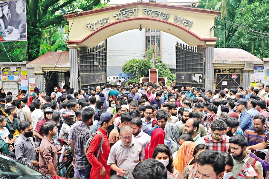 Candidates of the 45th BCS Examinations streaming out of Eden Women's College, an exam centre in Dhaka, after writing the preliminary test on Friday — FE photo