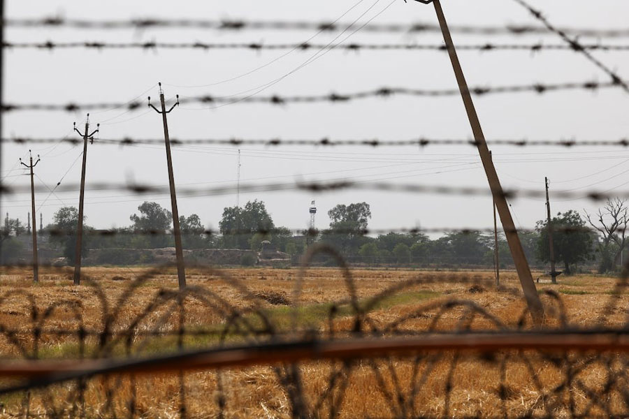 A Pakistan flag is seen on Pakistan Rangers' Post near the Attari-Wagah border crossing near Amritsar, India, April 26, 2025. India has suspended visa services to Pakistani nationals "with immediate effect" following an attack on tourists near Pahalgam in south Kashmir.