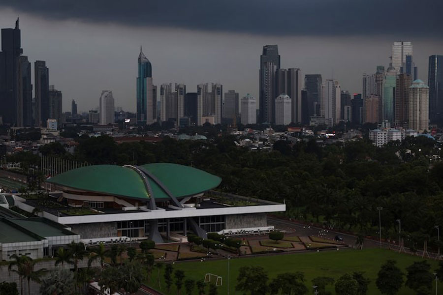 Indonesian Parliament building stands with the skyline in the background in Jakarta, Indonesia, April 25, 2025.