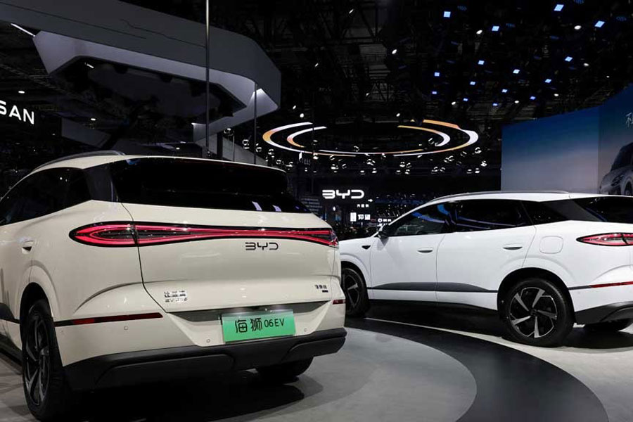 A BYD Sealion 06 electric vehicle (EV) is displayed alongside a BYD Sealion 05 DM-i during a media day for the Auto Shanghai show in Shanghai, China Apr 23, 2025.