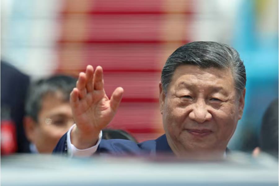 Chinese President Xi Jinping waves as he arrives for a two-day state visit, at Hanoi's Noi Bai International Airport, Vietnam, April 14, 2025.