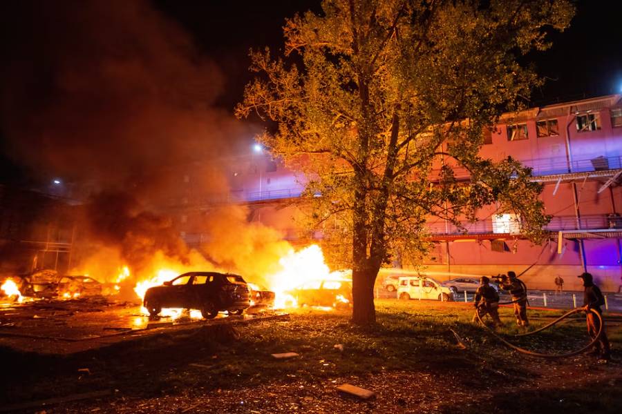 Firefighters work at the site of a Russian drone strike, amid Russia's attack on Ukraine, in Kyiv, Ukraine May 4, 2025.