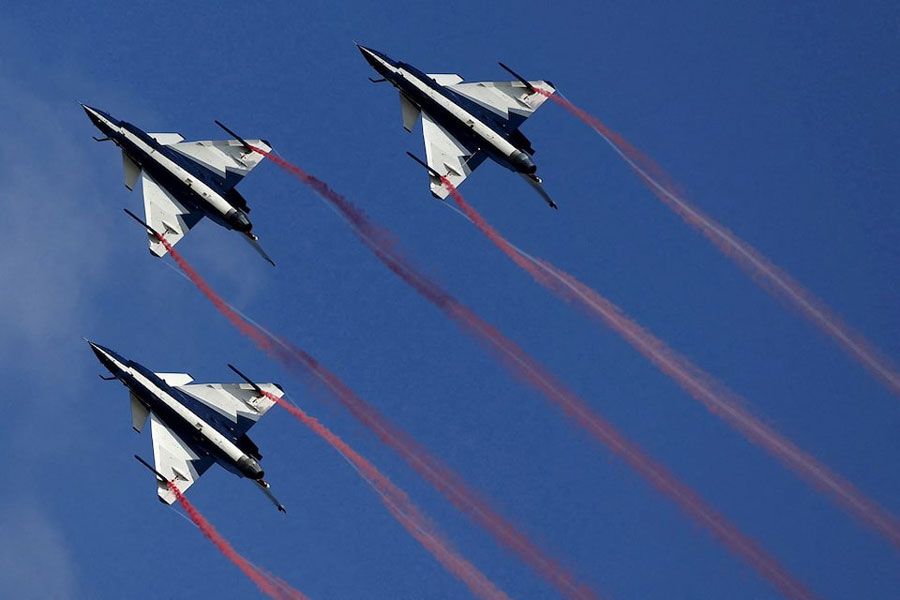 China's J-10 fighter jets from the People's Liberation Army Air Force August 1st Aerobatics Team perform during a media demonstration at the Korat Royal Thai Air Force Base, Nakhon Ratchasima province, Thailand, November 24, 2015.