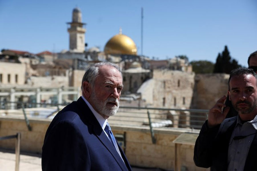 US Ambassador to Israel Mike Huckabee looks on during the day he visits the Western Wall, Judaism's holiest prayer site, in Jerusalem's Old City, April 18, 2025.
