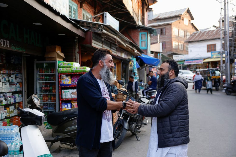 Kashmiri men greet each other after the ceasefire announcement between India and Pakistan, in Srinagar, May 10, 2025.