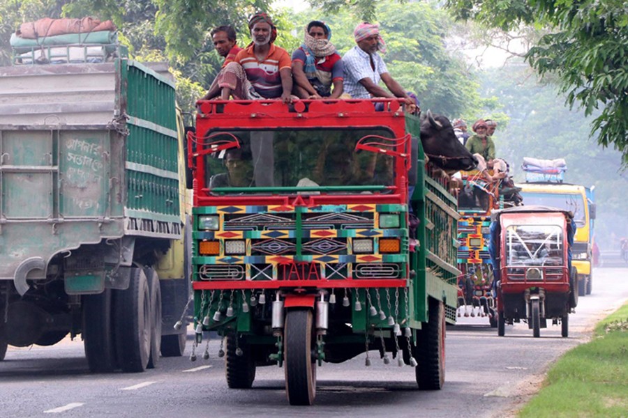 An overloaded battery-run rickshaw was pictured plying a road amid risk in Paba upazila of Rajshahi district recently- FE Photo