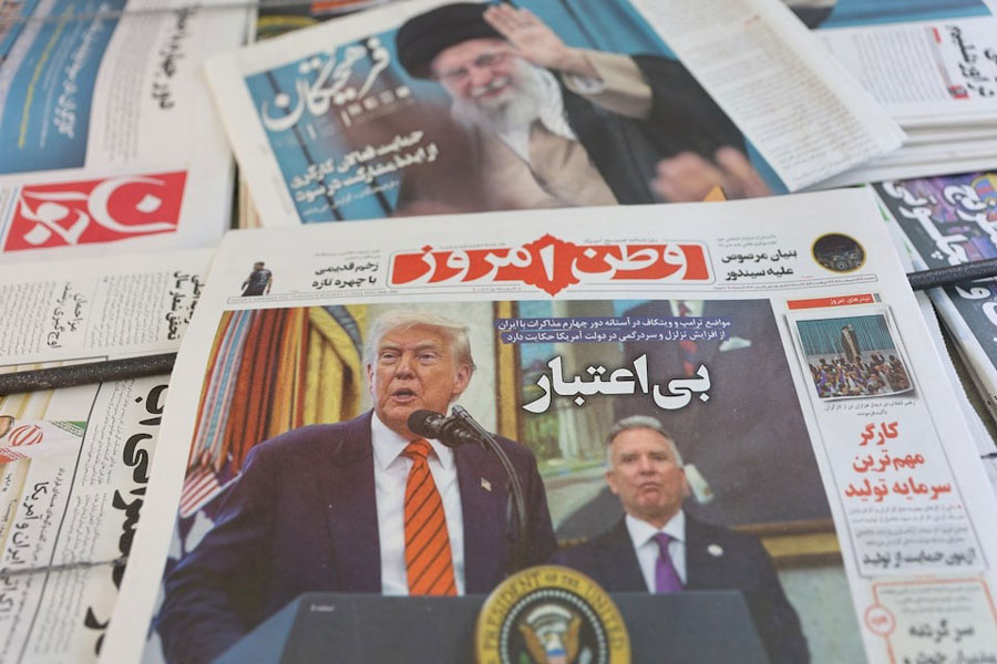 An Iranian newspaper with a cover photo of US President Donald Trump and US Middle East envoy Steve Witkoff, is seen in Tehran, Iran, May 11, 2025.