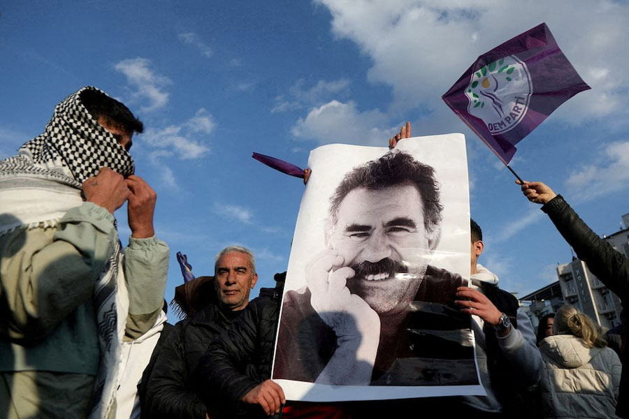 A demonstrator holds a picture of jailed Kurdish militant leader Abdullah Ocalan during a rally in Diyarbakir, Turkey, February 27, 2025.