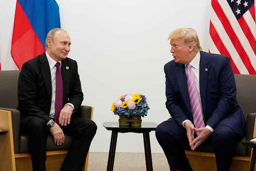 Russia's President Vladimir Putin and US President Donald Trump talk during a bilateral meeting at the G20 leaders summit in Osaka, Japan, June 28, 2019.