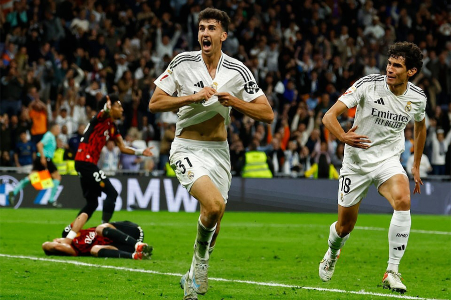 Real Madrid's Jacobo Ramon celebrates with teammate Jesus Vallejo after scoring their second goal during the LaLiga match against RCD Mallorca at the Santiago Bernabeu in Madrid, Spain on May 14, 2025 — Reuters photo